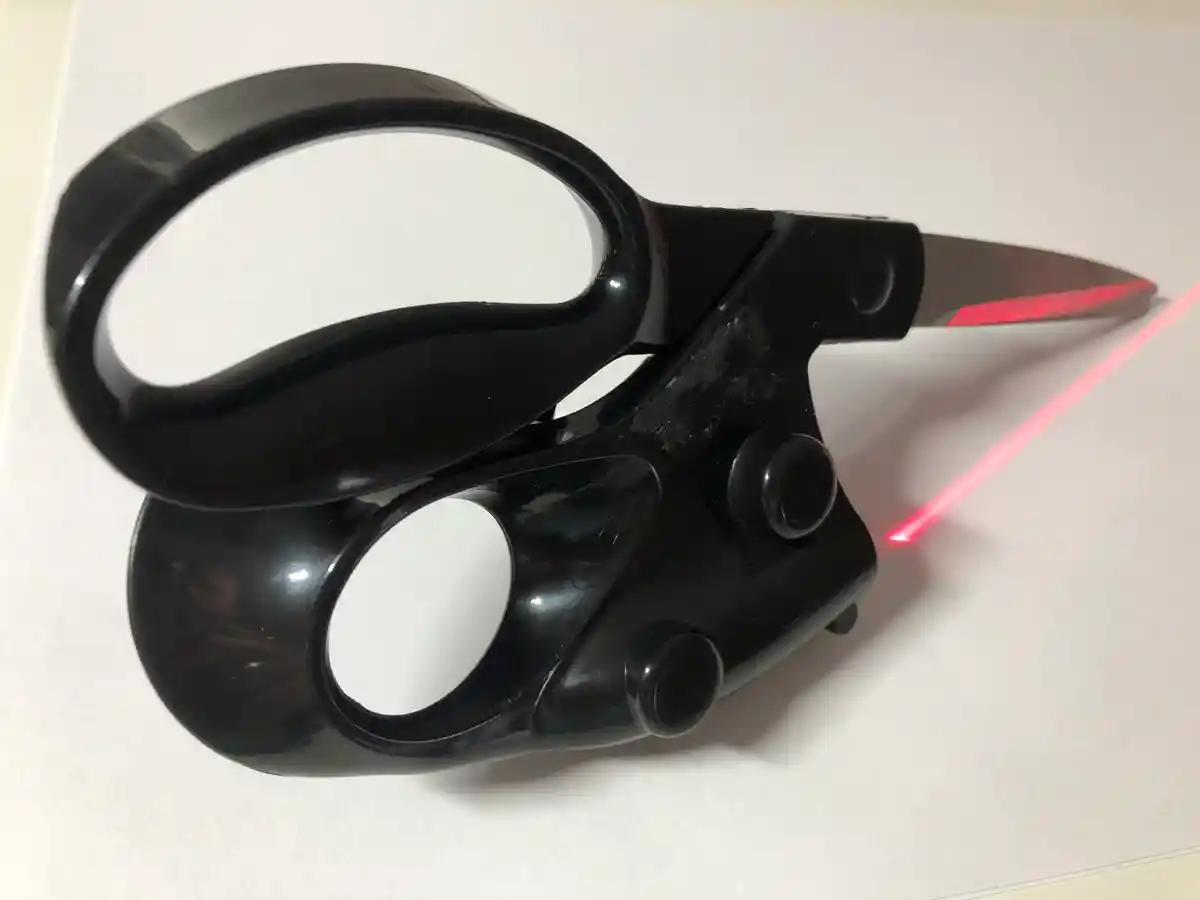 Scissors with a laser mounted on them to help cut straight